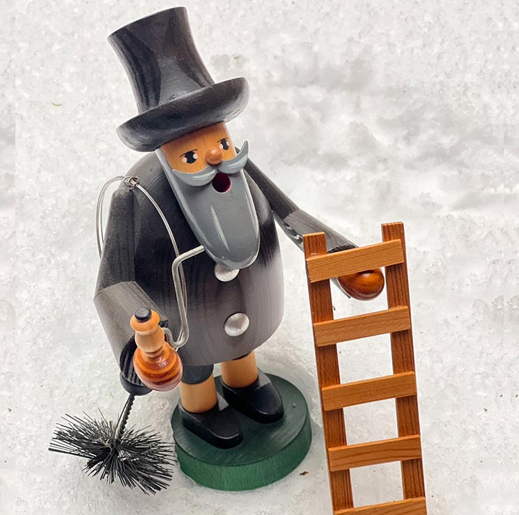 Wooden figure of a chimney sweep